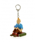 Clauer Tintin assegut amb bol de llet de iac