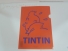Dossier silueta Tintin fons taronja Dossier silueta Tintin fons taronja