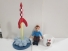 Lote de Cohete lanzamineto + peluche Tintín + taza Haddock Lote de Cohete lanzamineto + peluche Tintín + taza Haddock